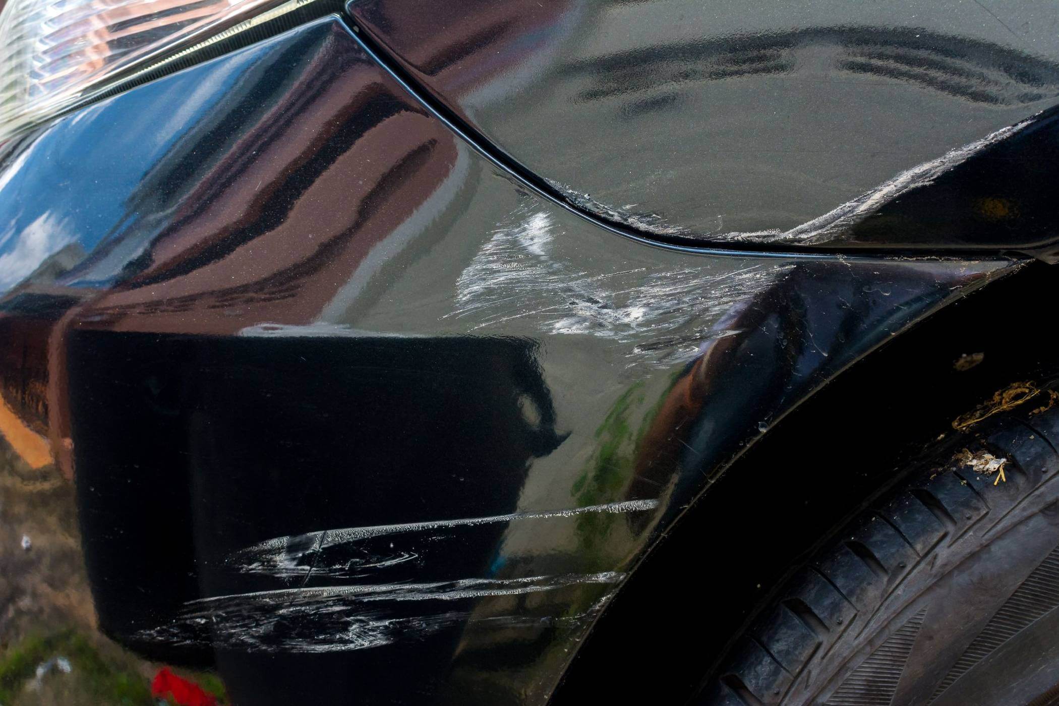 Scratch On Black Car